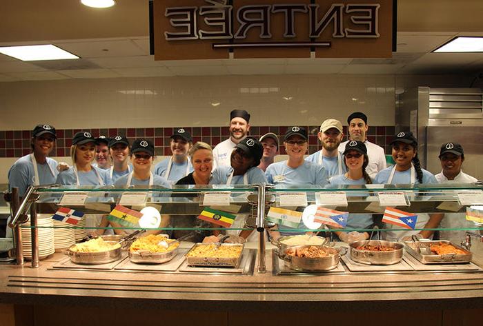 HM Student serve their dinner they prepared.