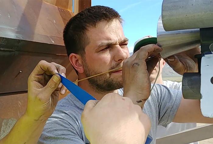 Kale Odhner makes the final adjustments to the rocket