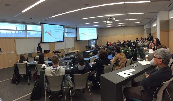 Sudents listen to a presentation in a classroom
