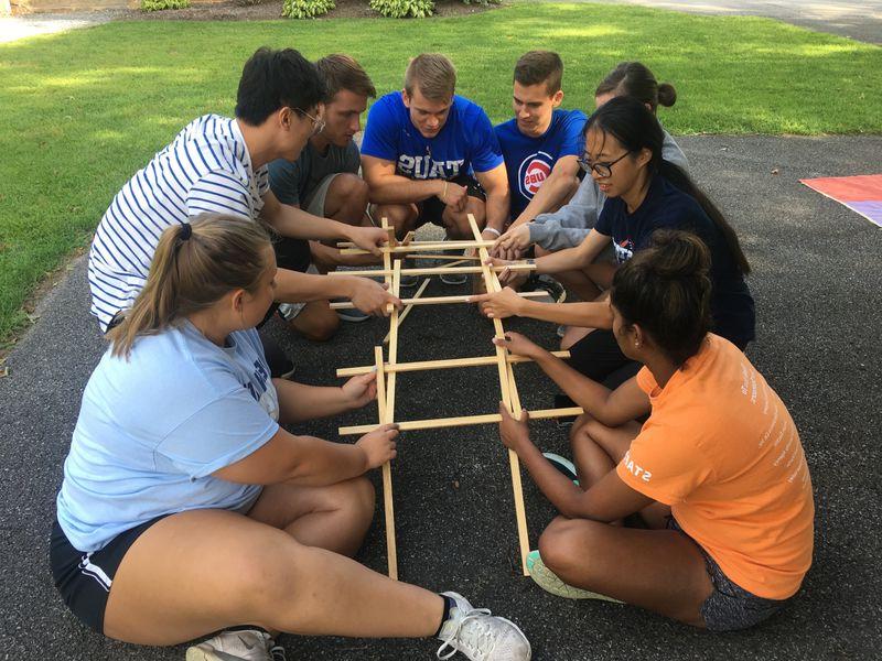 Students use wooden pieces to build replica of the Da Vinci bridge