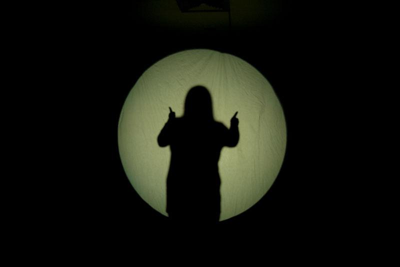The shadow of student giving thumbs up