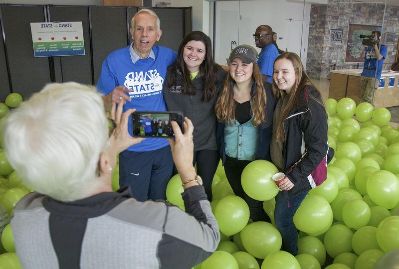 Mike the Mailman posing with students