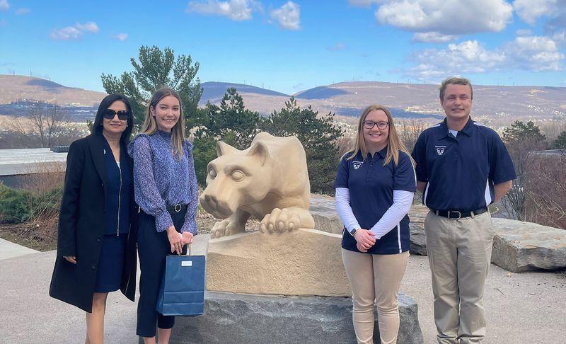 students pose with president-elect bendapudi at scranton lion shrine