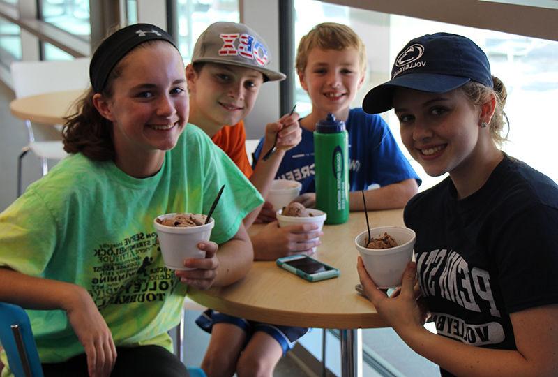 Kids enjoying Creamery ice cream at Homecoming