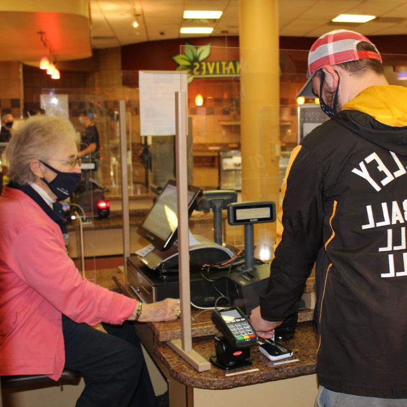 Port Sky cashier Theresa "Terry" Karcz helps a Penn State Altoona student "swipe out hunger" 