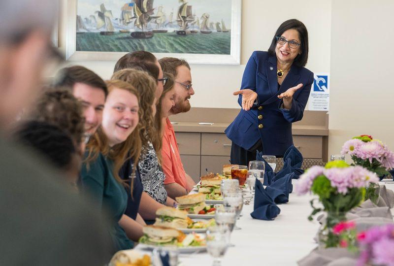 Penn State President-elect Neeli Bendapudi gestures while talking with student leaders at Penn State Behrend.