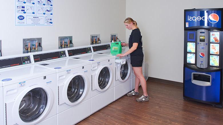 Student in on-campus laundry facility