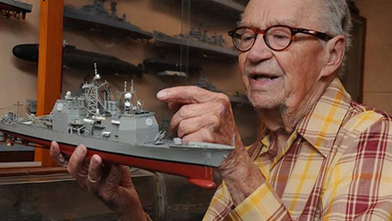 Ed Wiswesser pictured with a model train.
