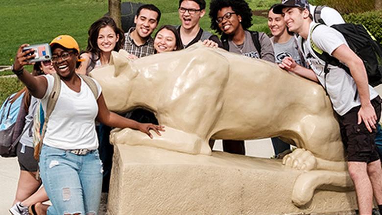 Berks students take a selfie in front of the Lion shrine