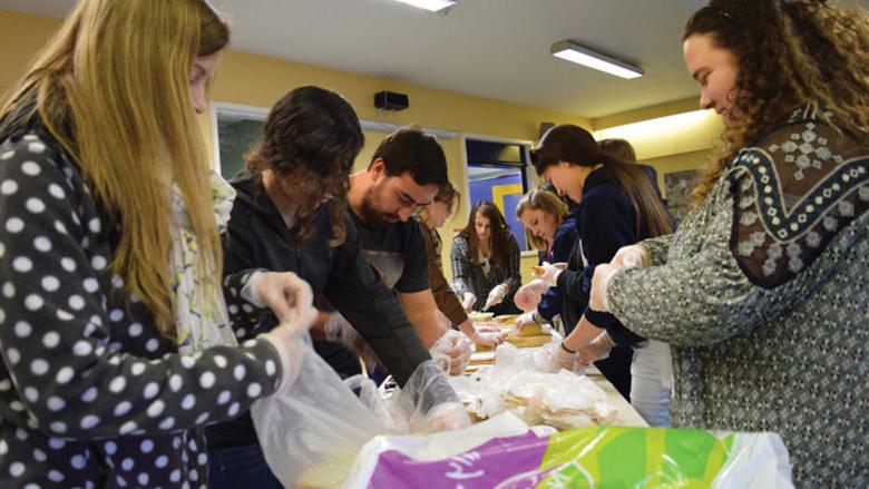 Penn State Berks students formed an assembly line to make as many sandwiches for the homeless as possible between sessions.