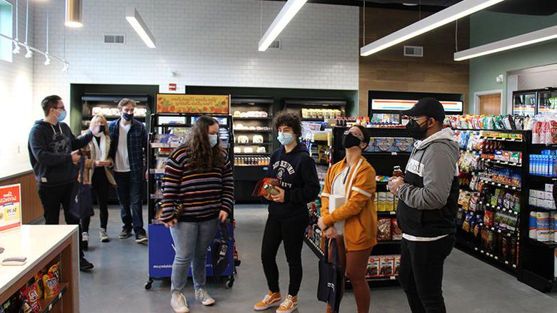 Student inside the newly open Creekside Market at Penn State Berks.