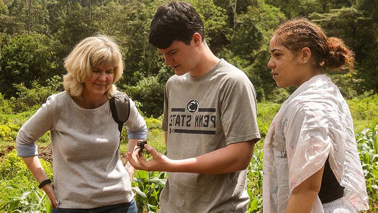 Janelle Larson helps plant trees.
