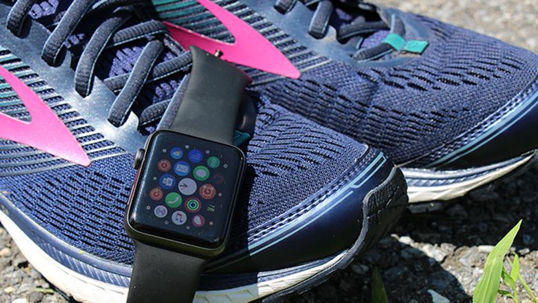 An Apple Watch and a pair of running shoes