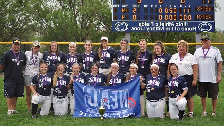 Berks Softball team with NEAC Championship flag
