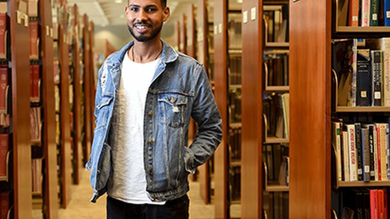 Tesfay Rezene in the library at Penn State Berks
