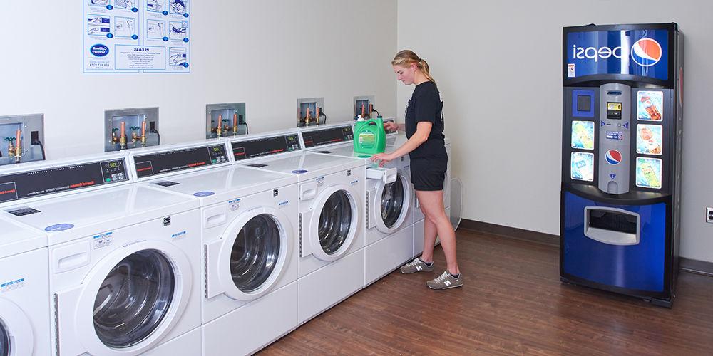 Student in on-campus laundry facility