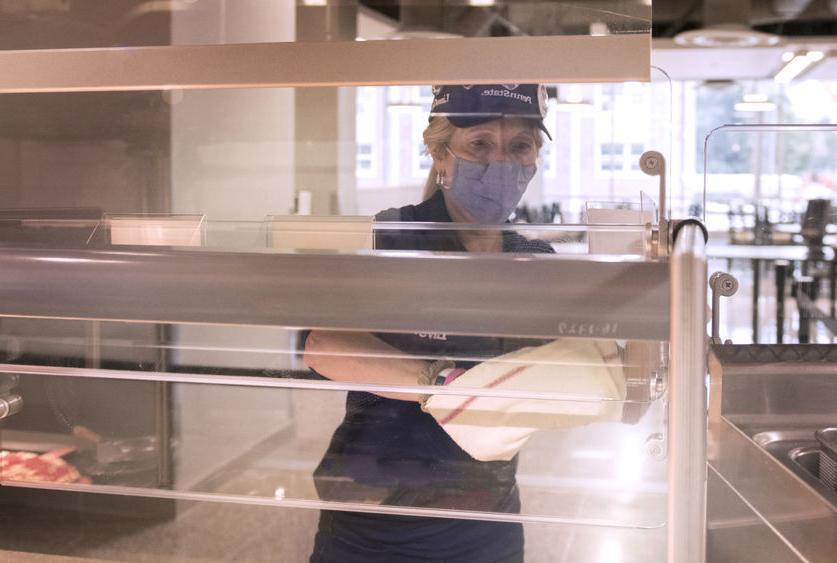 employee masked at dining hall