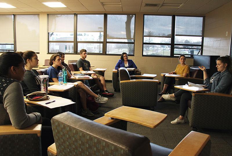 The students who will travel to Puerto Rico meet on campus to prepare.