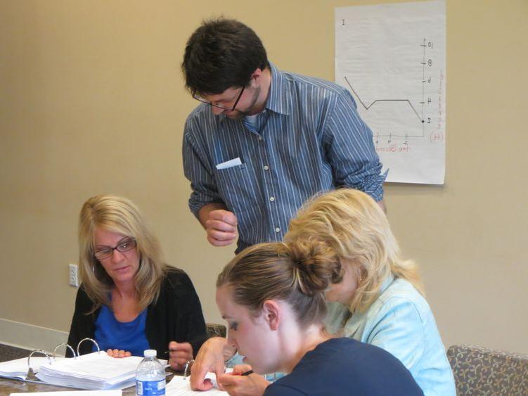 Andrew Baxter helping PMI participants