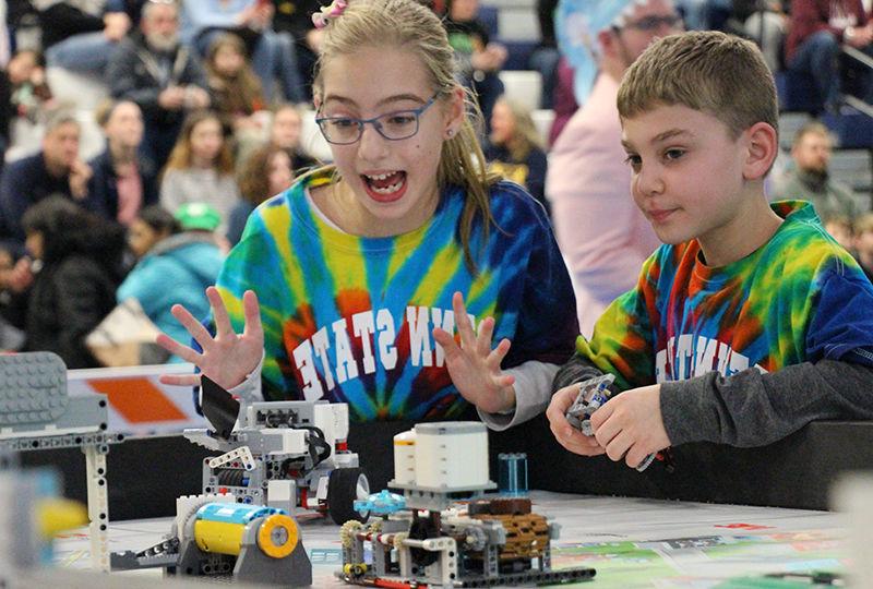 Smart Software team members Ryan Avram and Caylyn Hauser present their robot during the tournament.