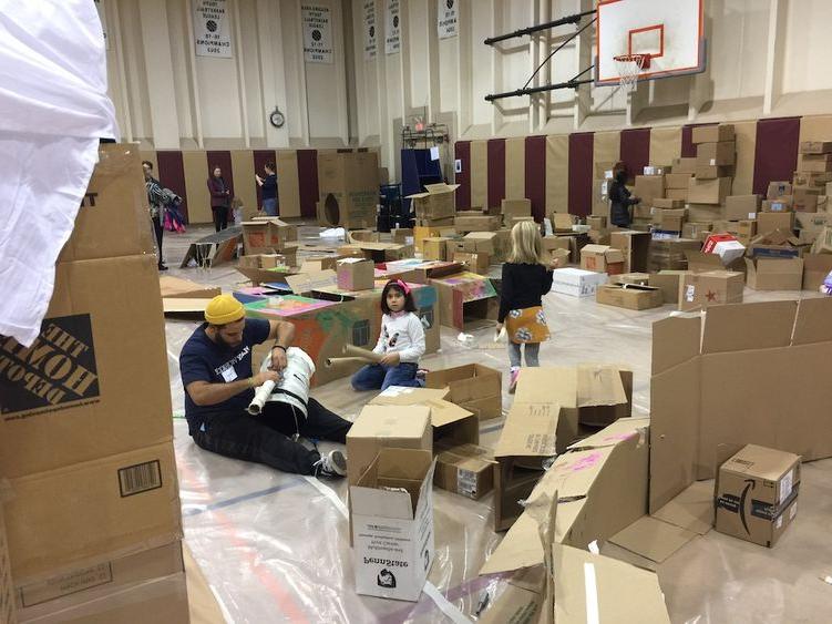 Photograph of gymnasium interior with cardboard boxes