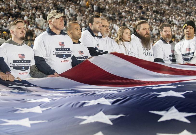 Veterans hold flag