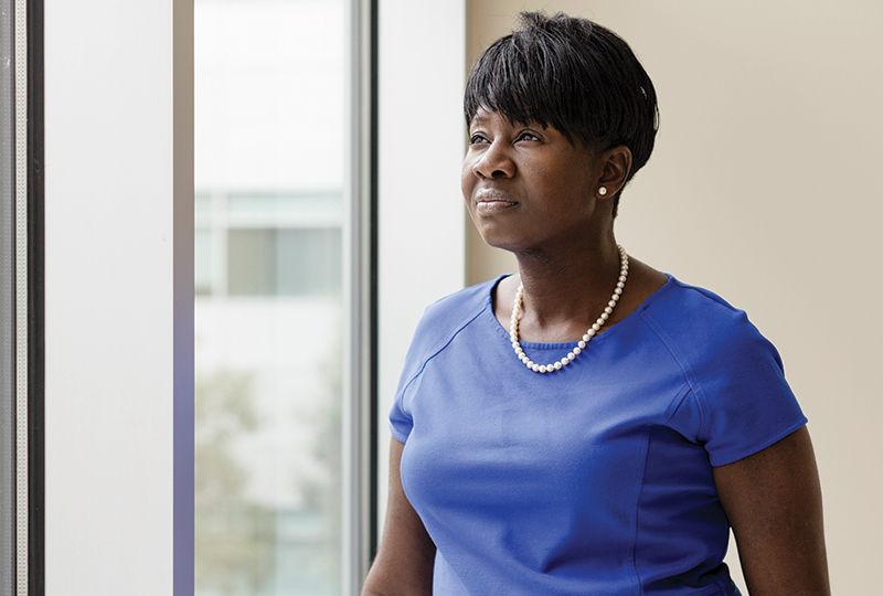 Dr. Kesha Morant Williams stands by a window at the Penn State Health St. Joseph location