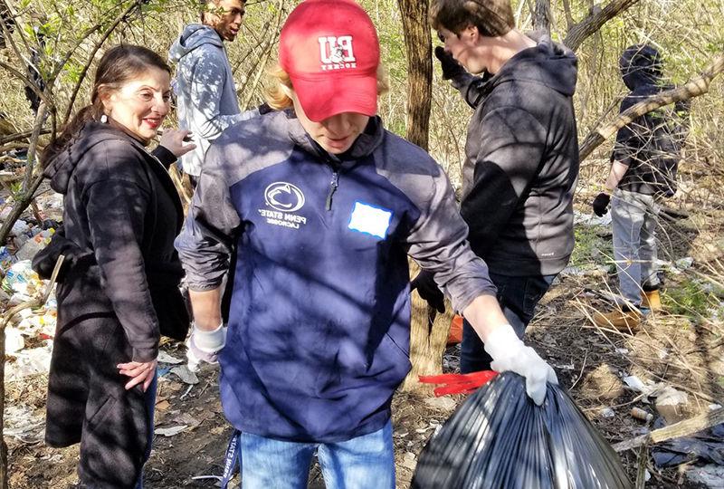 Students help cleanup park trails.
