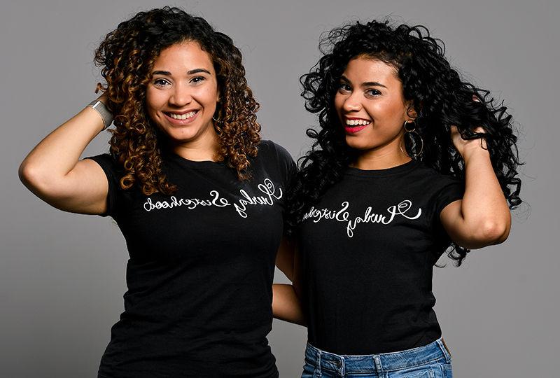 The Varona Sisters pose with their Curly Sisterhood t-shirts.