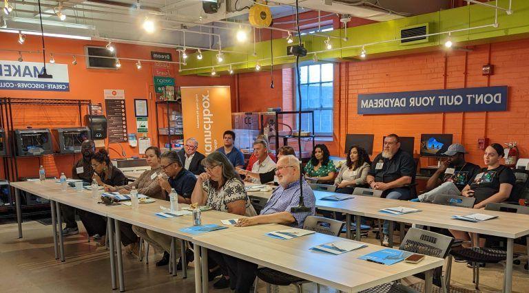 Attendees sit in Berk LaunchBox presentation