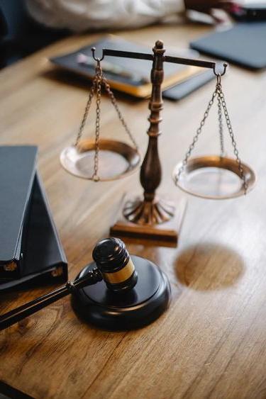 Justice scales, gavel, and books.