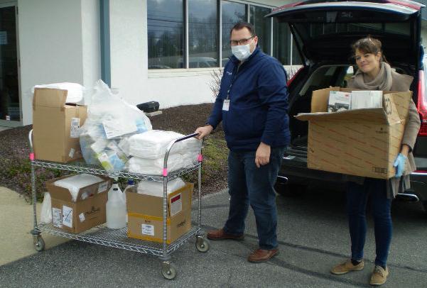Lisa Weaver transferring a large donation of medical supplies.