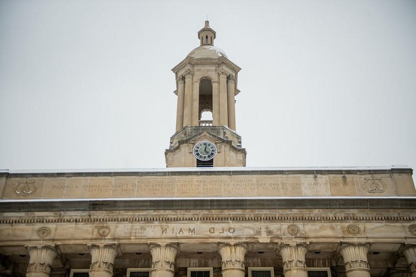 Tower of campus building with grey skies in background.