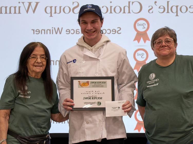 Student Souper Bowl winner is pictured with Food Services staff.