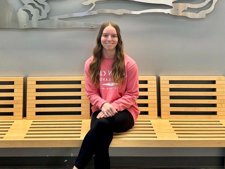 Photo of Sydney Bankert sitting in Gaige Building